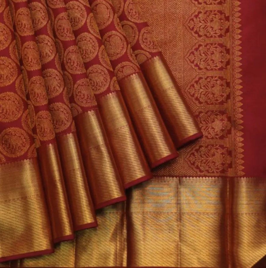 Aruṇadukūlaparidhānam The Divine Mother Is Robed in red silk.