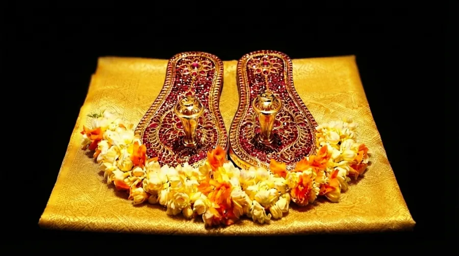 Śrīman Māṇikya Pāduke The Ruby Sandals are offered At The Divine Feet Of Maa.